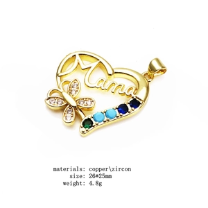 Detail of copper gold-plated Mama heart pendant with colorful zircons and butterfly design