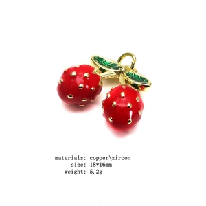Detail showing red enamel strawberry charms with copper zircon leaf measuring 18x16mm