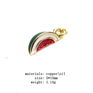 Detail showing a 5x15mm watermelon enamel charm in copper with gold plated edges