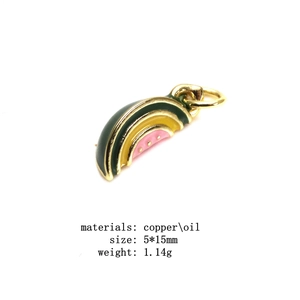Detail of watermelon charm pendant with copper and pink enamel finish for DIY jewelry
