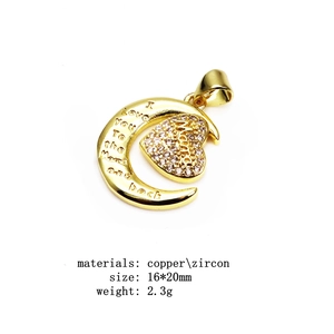 Macro detail of gold plated copper mama heart pendant with zircon inlays and measurements