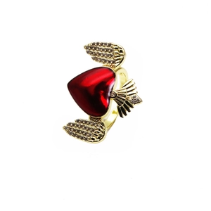 Close-up of red heart ring with zircon-encrusted gold wings and adjustable band