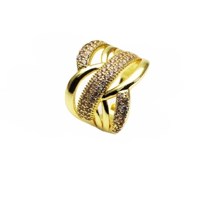 Macro shot of gold-plated multi-layer ring with sparkling micro-pave champagne zircons