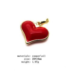 Detail showing red drip oil heart pendant with copper gold plating and size measurements