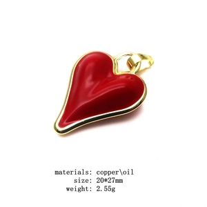 Detail of red enamel heart pendant with gold plated copper frame and size specs