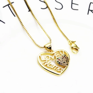 Detail of gold heart pendant with LOVE YOU Mama text and colorful pavé cubic zirconia stones