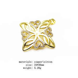 Detail view of gold-plated copper Celtic knot pendant with zircon inlay dimensions