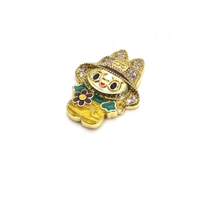 Macro view of gold-plated cartoon girl pendant with colorful enamel and zircon inlay