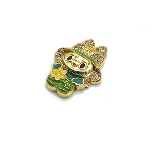 Macro detail of Labubu-style cartoon charm with green enamel and cubic zirconia inlays