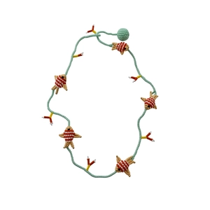 Handmade glass beaded necklace with colorful fish charms for a summer vacation look.