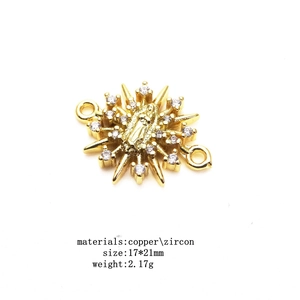 Detail of 18k gold plated starburst religious connector with zircon and dimensions