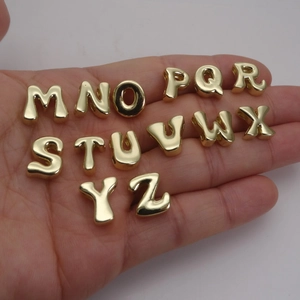 3D 14K gold plated letter charms M to Z for DIY jewelry making displayed on hand