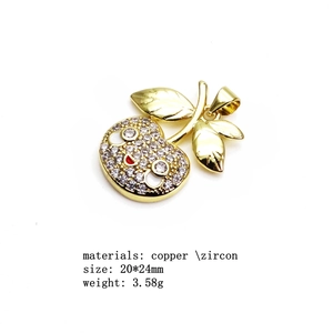 Copper gold plated cherry pendant necklace with pavé cubic zirconia and red enamel detail