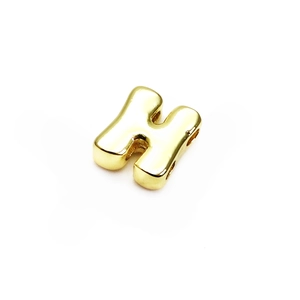 Close-up of 14K gold plated letter H bead with polished mirror finish and horizontal hole