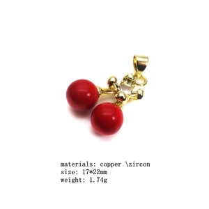 Detail of copper gold cherry pendant with red beads and zircon, size 17x22mm