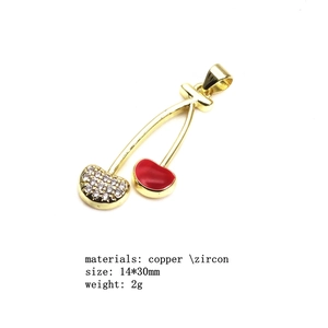 Detail showing red enamel and zircon cherry pendant size 14x30mm on gold chain