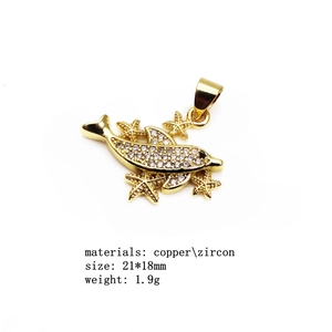 Detail of copper dolphin pendant with micro-set zircons and golden starfish accents