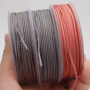 Detail of 1.4mm and 1.7mm two-tone braided cord on reels for jewelry making