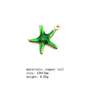 Detailed macro view of 15x17mm green enamel starfish pendant with copper gold-plated edges