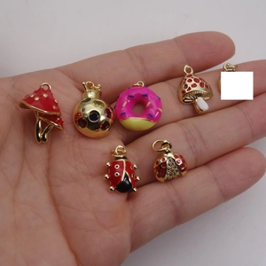 Assorted gold-plated mushroom and ladybug enamel charms for bracelets and necklaces