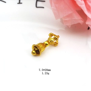 Macro shot of 7.5x20mm gold Vajra Bell pendant for DIY necklace and bracelet jewelry