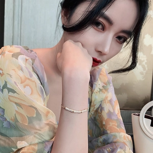 Elegant bamboo-joint bracelet with sparkling crystals displayed on model's wrist