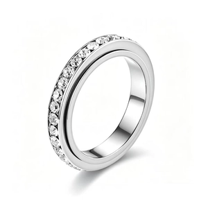 Detailed view of a silver-toned stainless steel spinner ring with full crystal inlay.