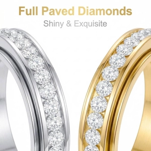 Detailed macro view of single row paved diamond spinner rings in gold and silver finish