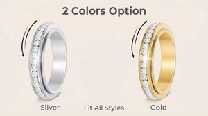 Detail view of gold and silver stainless steel spinner rings with single row CZ inlay