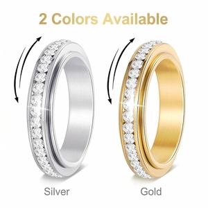 Stainless steel spinner rings with single row cubic zirconia in silver and gold colors