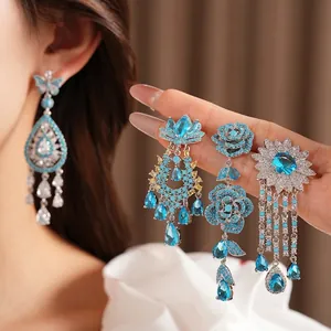 Set di orecchini vintage squisiti con zirconi blu, farfalla e goccia d'acqua per donna