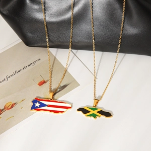 Detail of gold stainless steel necklaces with Puerto Rico and Jamaica flag map pendants.