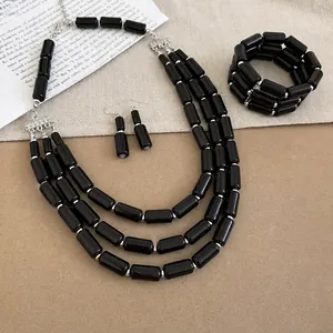 Bold black acrylic multi-layer jewelry set featuring necklace bracelet and earrings