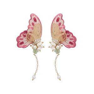 Elegant embroidery butterfly earrings with pearls and long tassels on white background