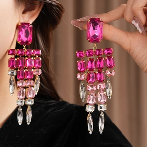 Close-up view of pink crystal tassel earrings featuring vintage square cut rhinestones for women