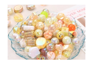 Close-up of colorful electroplated acrylic beads in macaron tones for DIY jewelry making