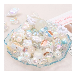 Mix of iridescent white acrylic beads in shell, heart, and star shapes for DIY jewelry making