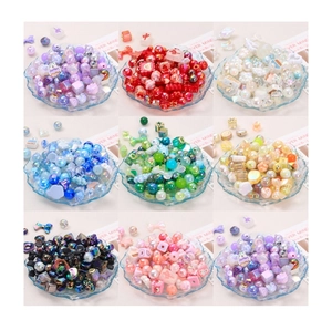 Close-up of colorful acrylic and resin bead assortment for DIY jewelry making kits
