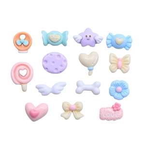 Assorted mini macaron resin charms in candy and heart shapes for DIY craft making