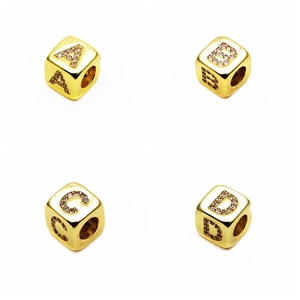 Macro shot of 6mm gold-plated alphabet beads A-D with micro-pave cubic zirconia settings