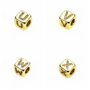 Macro shot of gold square alphabet charms U V W X with micro-pave cubic zirconia