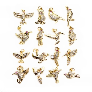 Collection of sixteen gold-plated bird charms with cubic zirconia inlays