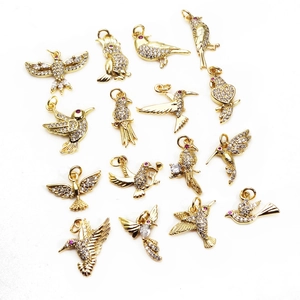 Bird charm pendants set with cubic zirconia pave and gold plating for jewelry making
