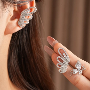 Close-up detail of silver butterfly ear cuff with sparkling cubic zirconia stones