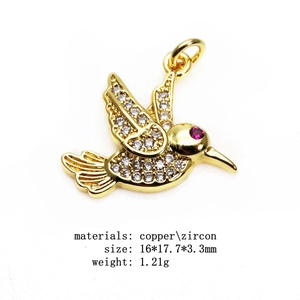Detail of hummingbird charm with white zircon pavé setting and dimensions on white background