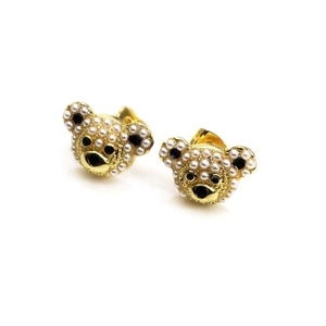 Close-up of bear earrings in 18K gold plated copper with inlaid white pearls