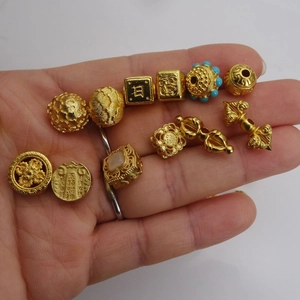 Golden DIY jewelry beads and pendants including vajra and lotus for bracelet making