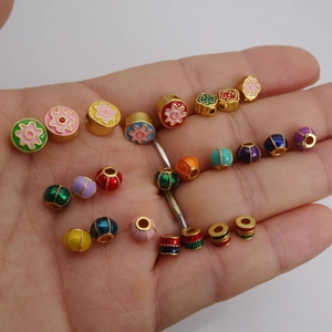 DIY jewelry beads with enamel flower patterns and gold-plated finish for bracelets