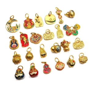 Golden enamel charms featuring traditional Chinese gourds and fortune bags on white background