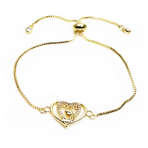 Macro shot of gold plated MAMA heart connector with cubic zirconia for DIY jewelry